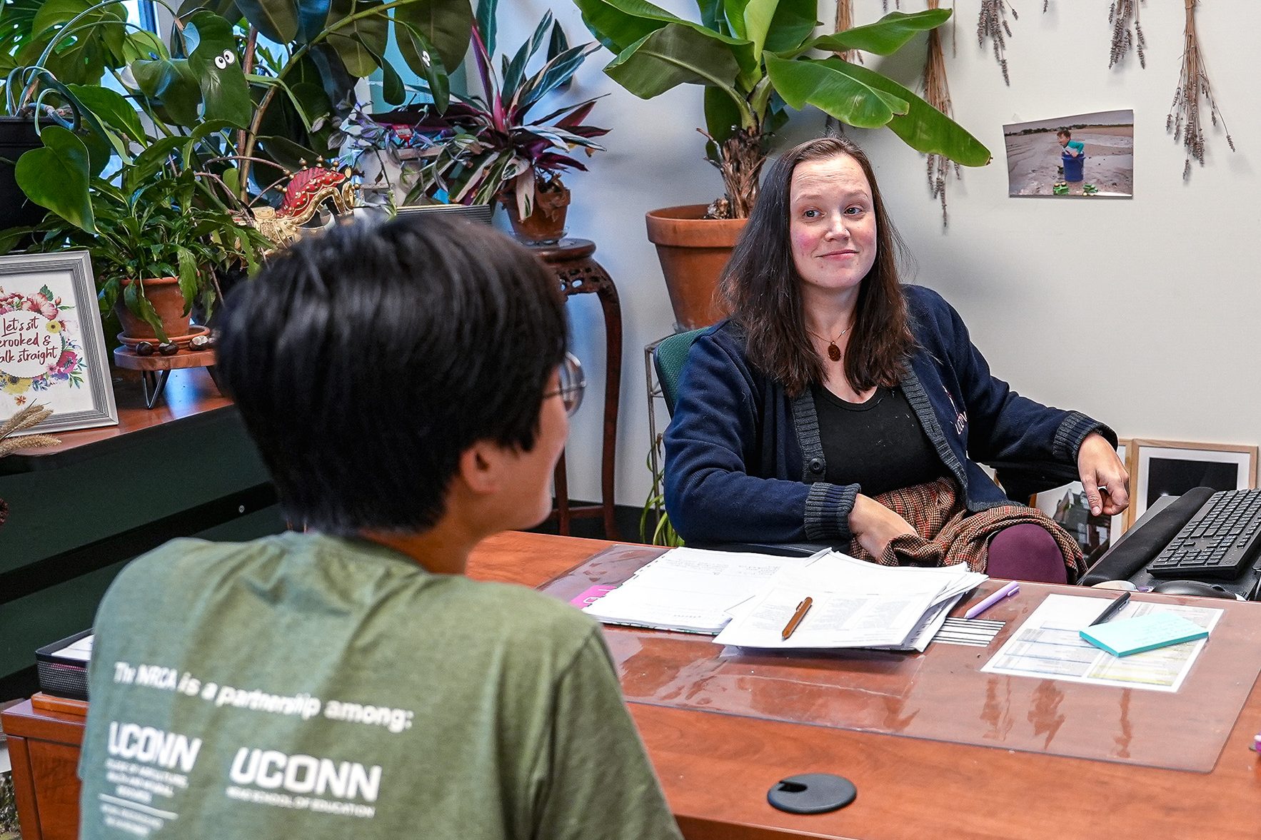 student and their advisor talking