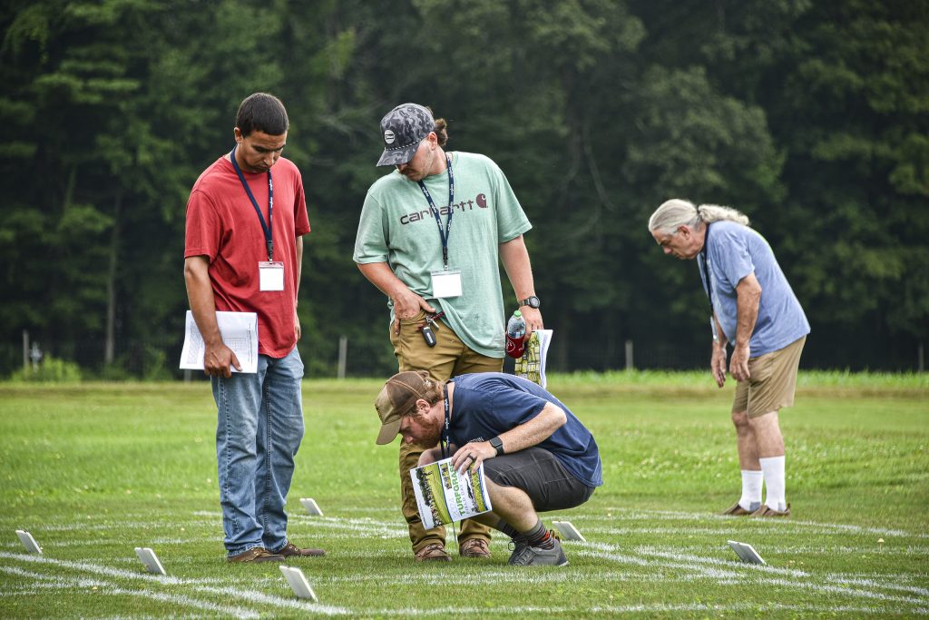attendees viewing turf samples at Turfgrass Field day